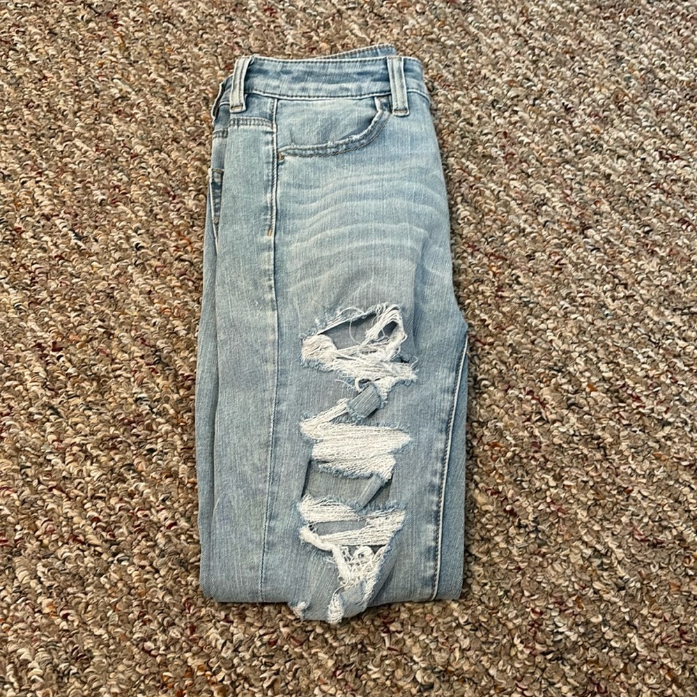 Light blue ripped American Eagle skinny jeans.